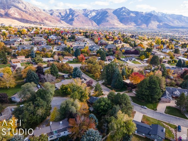 Aerial overview of property's location with mountains and nearby suburban area | Image 58