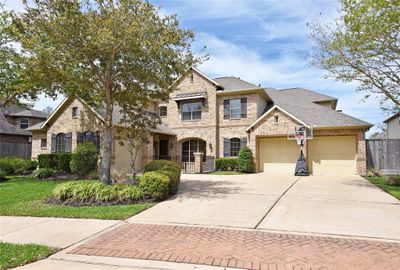 Featuring five spacious bedrooms and four and a half impeccably designed baths, this luxurious home offers an oasis of comfort and refinement in Sienna. | Image 3