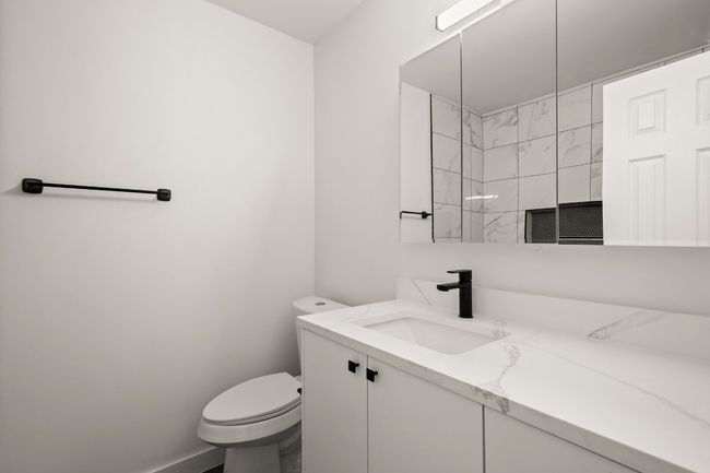 Full bath with vanity and a shower | Image 18