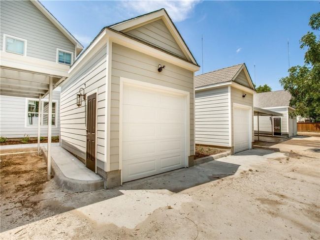 One of the seven one-car garages along the gated driveway of the complex. | Image 16