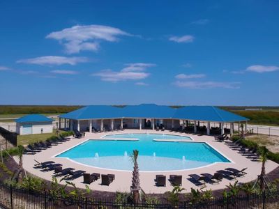 Immerse yourself in the ultimate oasis of leisure with this captivating image showcasing the exquisite clubhouse pool. Indulge your senses as you envision lounging by the shimmering waters, basking in the warm embrace of luxury. This is where relaxation meets elegance, offering you a taste of the extraordinary lifestyle that awaits at The Beachside Community | Image 3