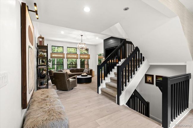 Stairs leading to upper and finished lower levels. | Image 6