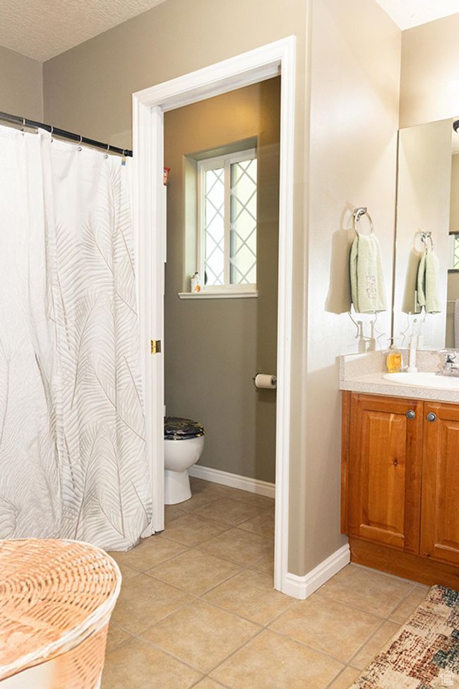 Full bath with vanity and tile patterned flooring | Image 15