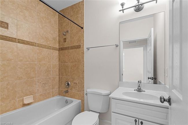 Full bathroom featuring vanity and bathtub / shower combination | Image 17