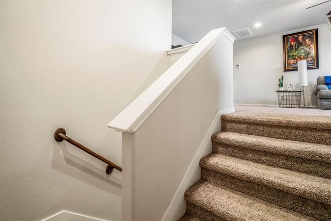 The stairs going to the second level of the home. | Image 38