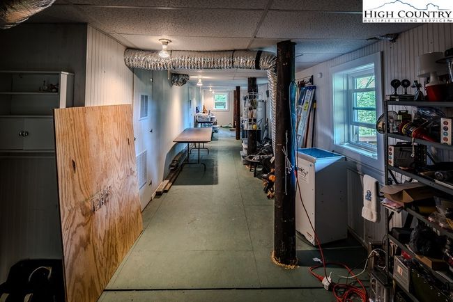 Partially finished basement great for workshop or storage | Image 43
