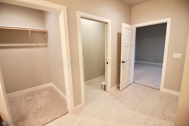 Private toilet area with pocket door | Image 25