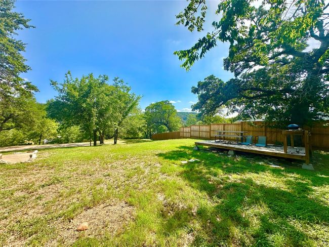 View of yard with a wooden deck | Image 38