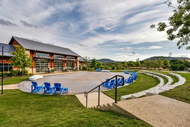 View of property's community featuring a mountain view and a yard | Image 28