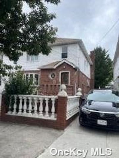 101-34 113th Street, Home with 6 bedrooms, 2 bathrooms and null parking in Richmond Hill South NY | Image 1