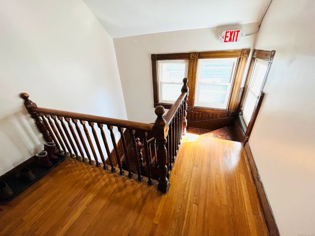 Front hallway outside the apartment. The back entrance is closest to the private garage. | Image 14