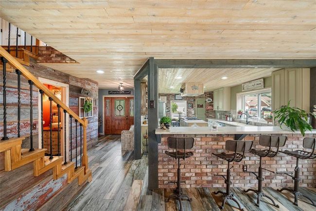 A charming open-concept dining area and kitchen | Image 11
