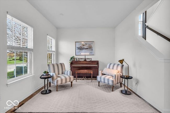 The formal living room offers versatility and can also be used as a dedicated office space or library. | Image 6