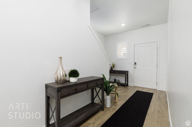 Entryway with baseboards, visible vents, light wood-type flooring, and recessed lighting | Image 6