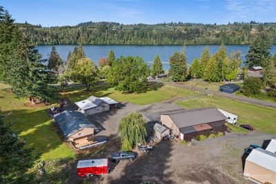 Three acres on Lake Mayfield with two homes, a one bedroom apt. full RV hook up, huge shop with gathering area. Outdoor gathering area and more! Must see! | Image 1