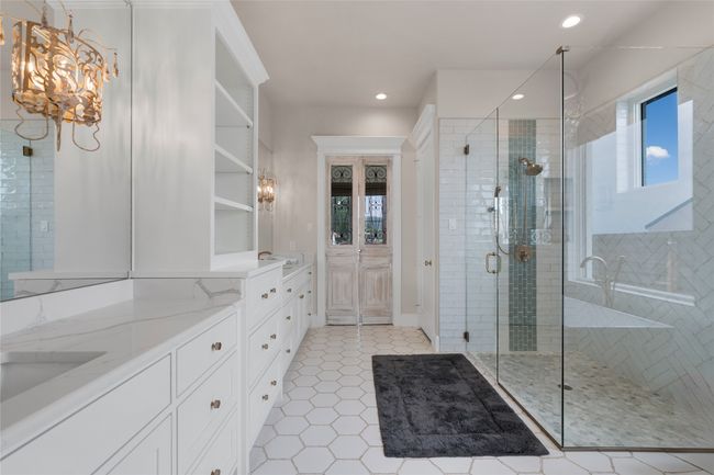 Full bath featuring vanity, a stall shower, recessed lighting, a chandelier, and tile patterned floors | Image 12