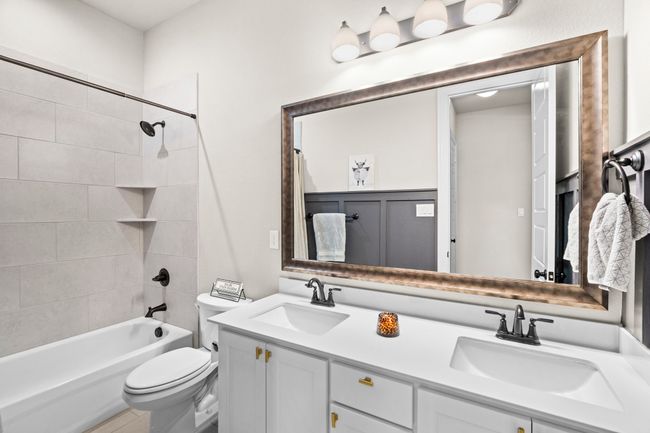 Full bath with double vanity and bathtub / shower combination | Image 31