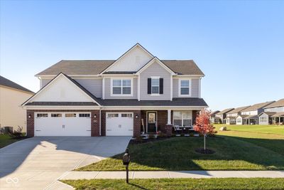 4262 Blackford Road offers full front porch, 3 car garage, premium pond lot, and added room between neighbors. | Image 1