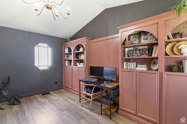 Office featuring lofted ceiling, a chandelier, and light wood finished floors | Image 7