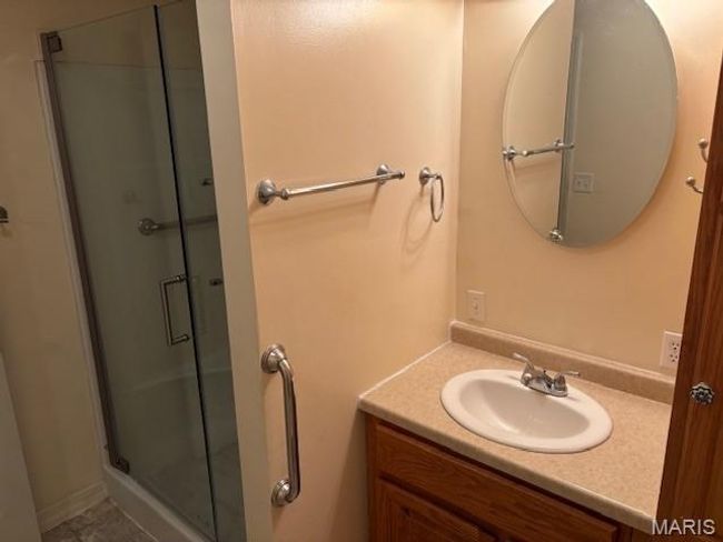 Full bath featuring vanity and a shower stall | Image 25