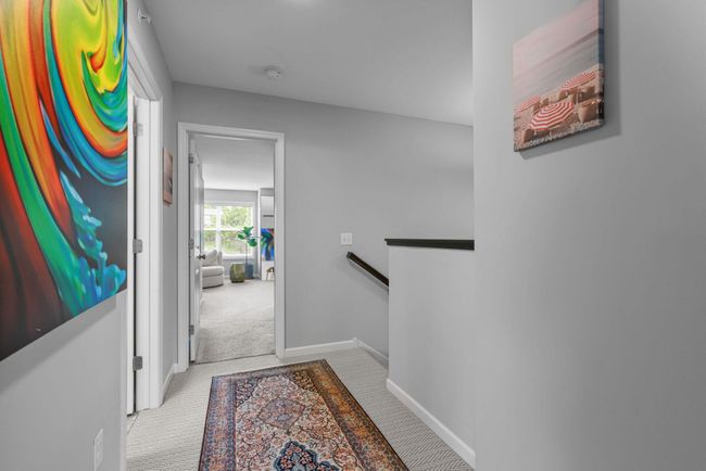 Staircase to upstairs, upper hallway sports newer carpeting. | Image 20