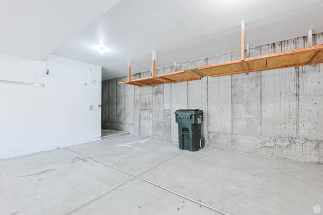 Garage also has storage space recessed from parking area | Image 37