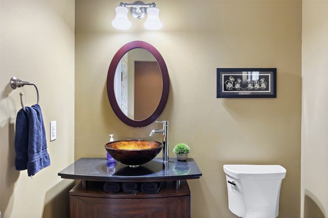 Bathroom with a sink and toilet | Image 14