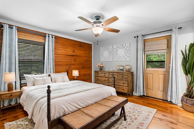 Virtually Staged Primary Bedroom. Per the sellers, rooms fits king sized bed with two end tables comfortably. | Image 20