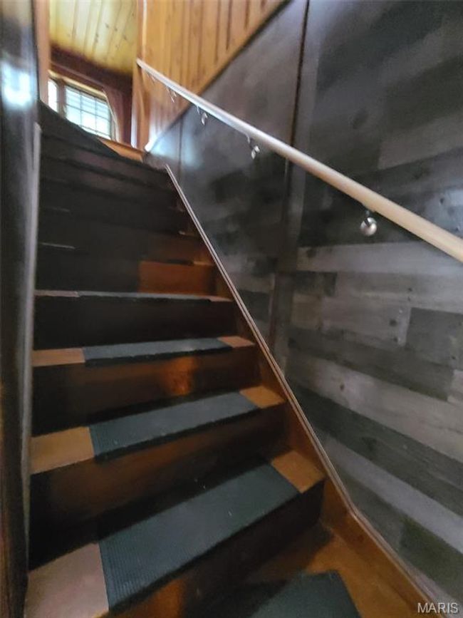 Stairway featuring wood walls | Image 15