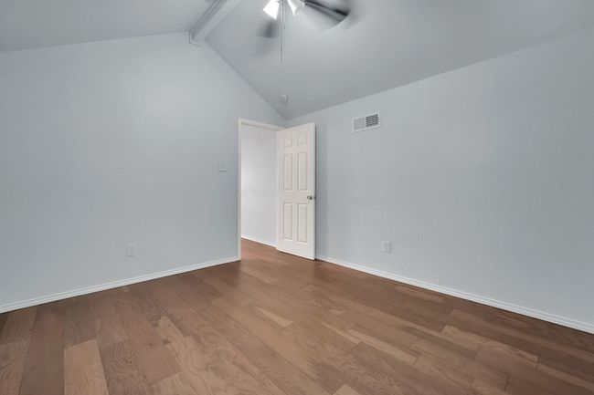 Empty room with ceiling fan and wood finished floors | Image 21