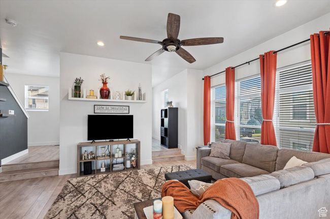 Living area with ceiling fan, recessed lighting, and wood finished floors | Image 9