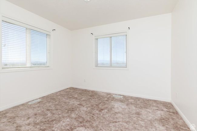 Carpeted spare room featuring baseboards | Image 24