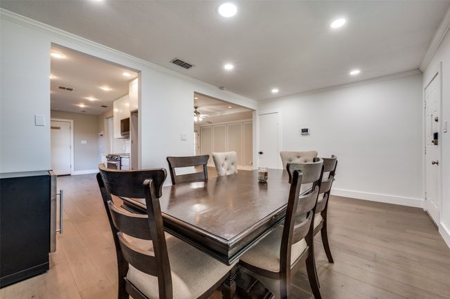 Dining room featuring ornamental molding, light wood-type flooring, recessed lighting, and ceiling fan | Image 5