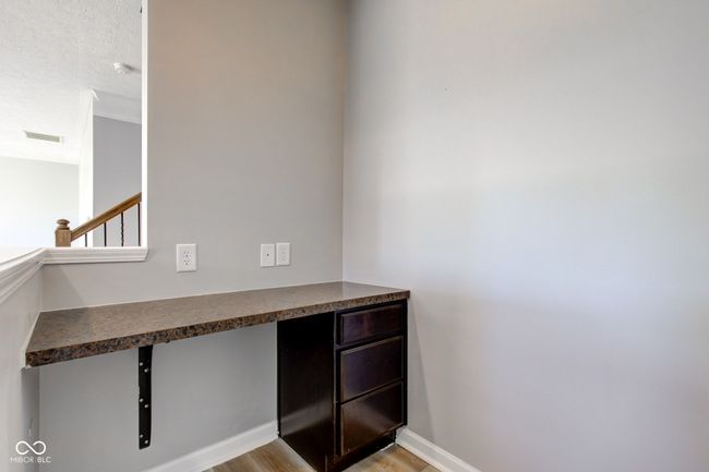 detailed view of wood finished floors and a smoke detector | Image 27