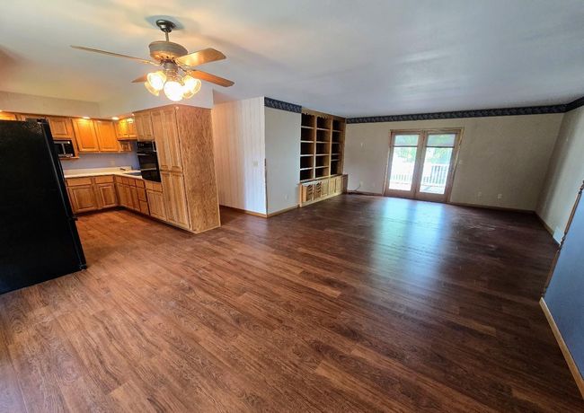 Attractvie vinyl plank flooring extends throughout the main floor kitchen, dining, living rooms, & hallway | Image 18