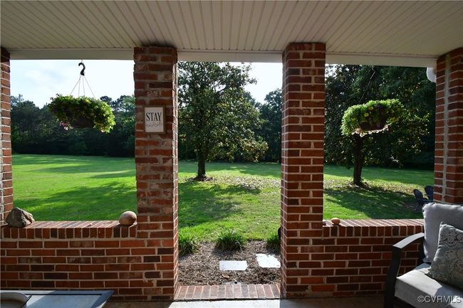 The covered porch, you will love summer nights out here! | Image 19