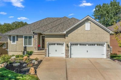 View of front of house featuring a garage | Image 2