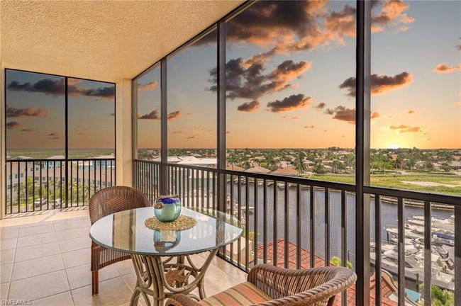 Balcony at dusk with a water view | Image 23