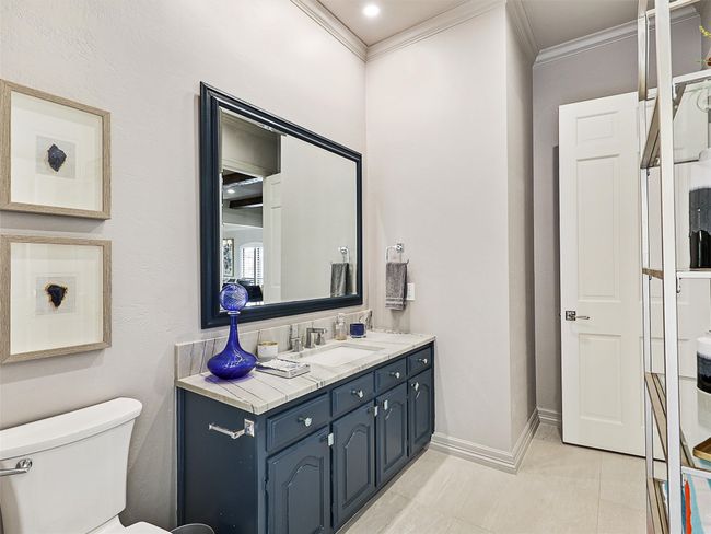 Bathroom featuring vanity and crown molding | Image 29