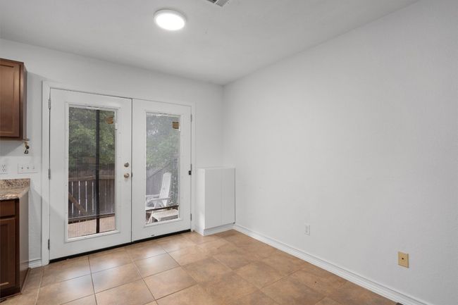 Doorway to outside with french doors and light tile patterned floors | Image 12