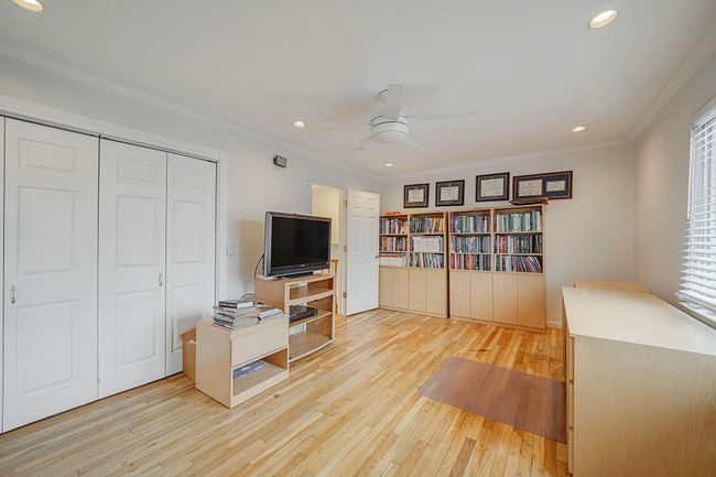 Home office with ornamental molding, ceiling fan, light hardwood / wood-style flooring, and plenty of natural light | Image 13