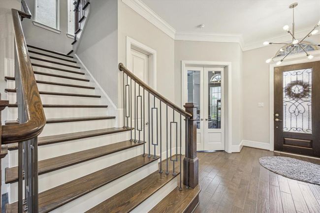 Tucked away through white double doors in the home office. Off to the left is the first-floor powder room. | Image 6