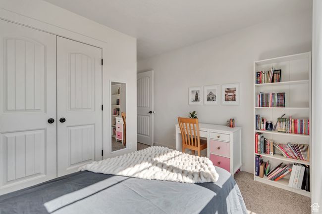 Bedroom with carpet flooring and a closet | Image 18