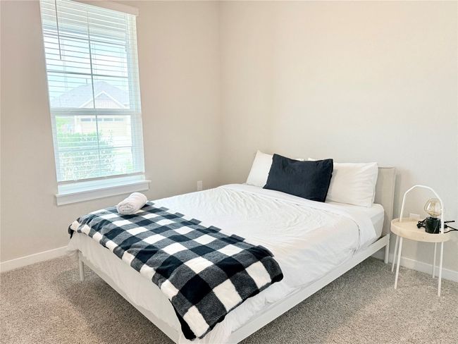 Carpeted bedroom with baseboards | Image 31