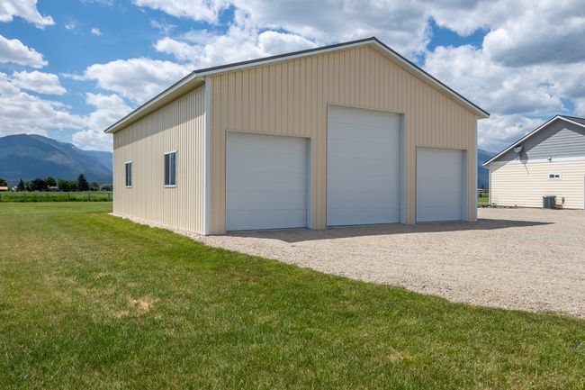 This is 40' x 50' w/cement floor. 14' middle door is drive-thru on opposite side. | Image 33