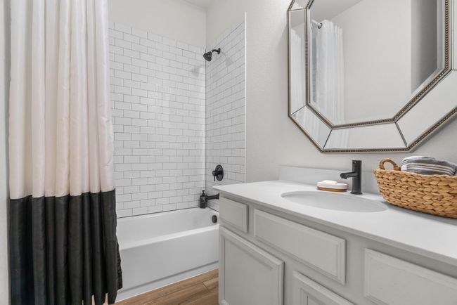 Full bathroom featuring vanity, shower / bath combo, and wood finished floors | Image 28