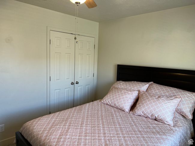 Bedroom with a ceiling fan and a closet | Image 21