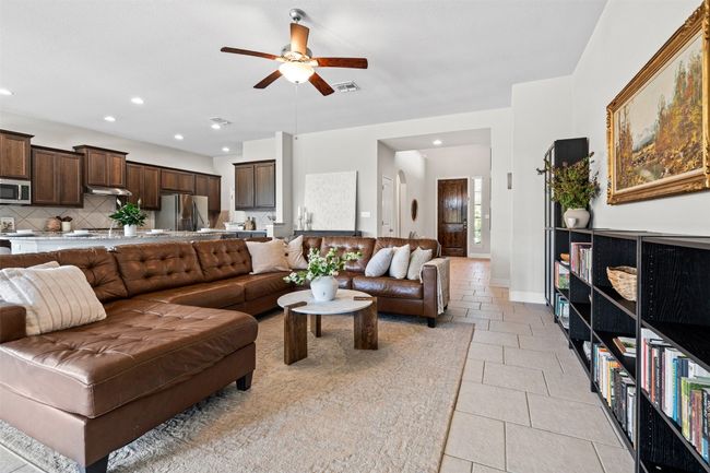 Beautiful kitchen looks out over living area making it perfect for entertaining. | Image 7