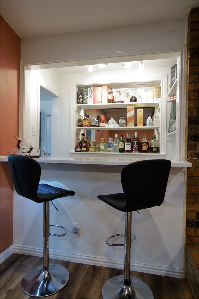 Indoor dry bar with dark wood-type flooring | Image 10
