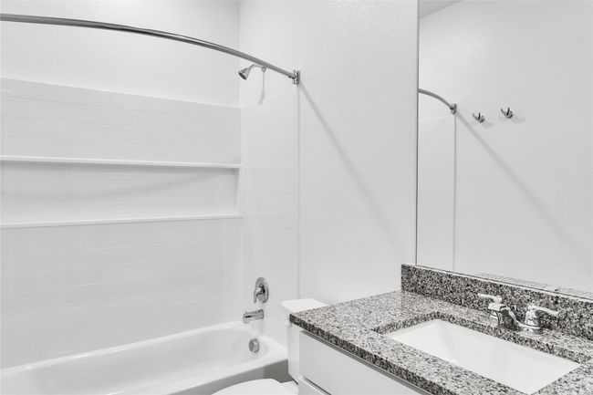 Full bath with tub / shower combination, vanity, and toilet | Image 6